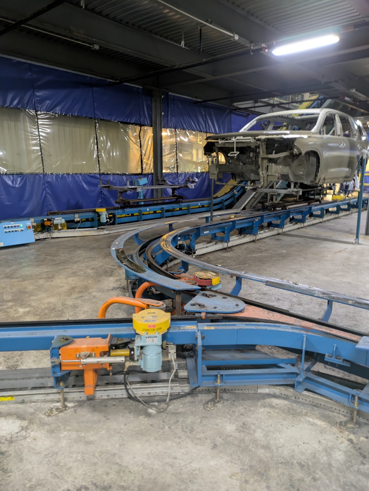 Vehicle chassis on an automotive assembly conveyor