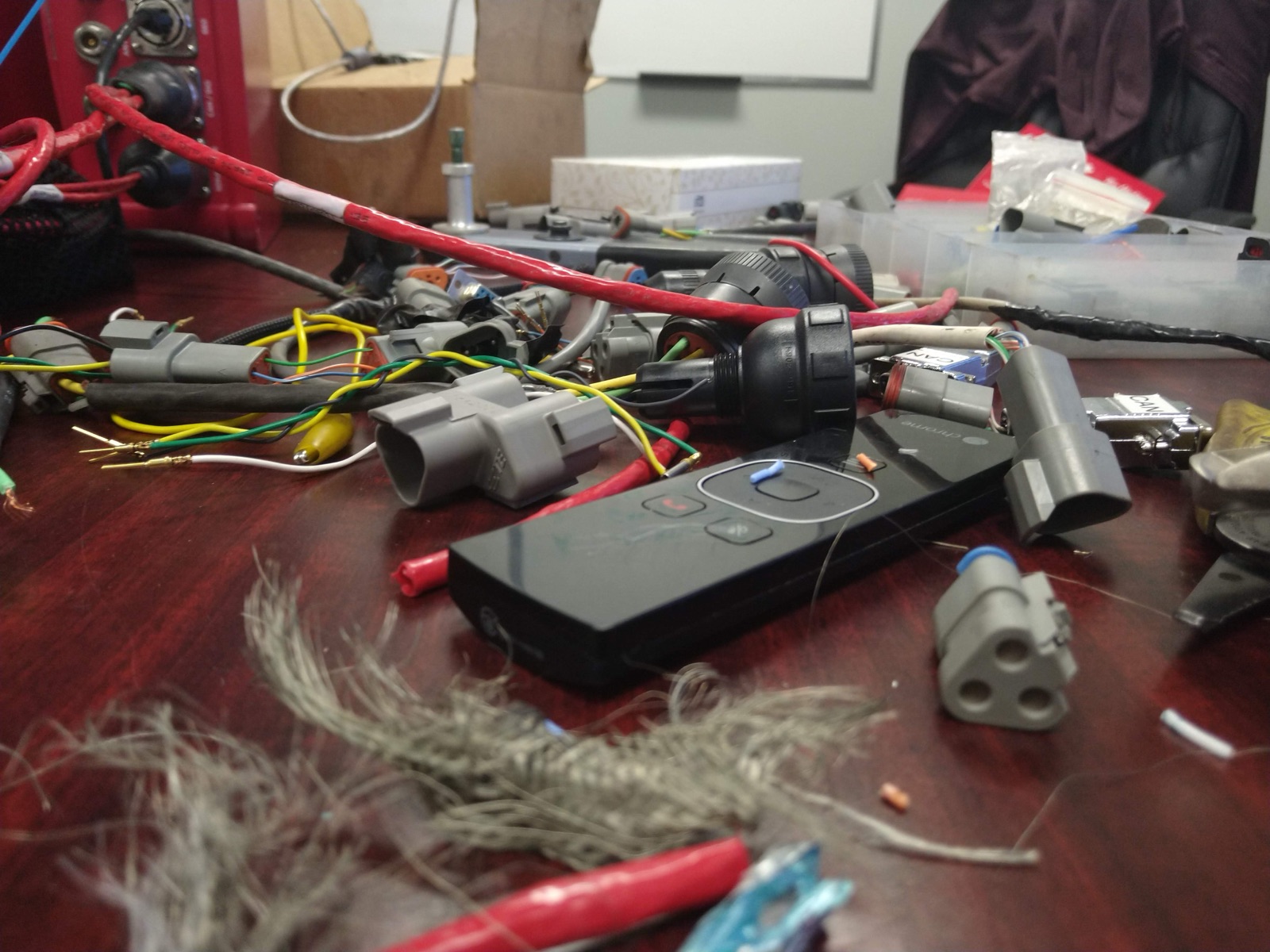 Disassembled electronic components and wiring on a workbench